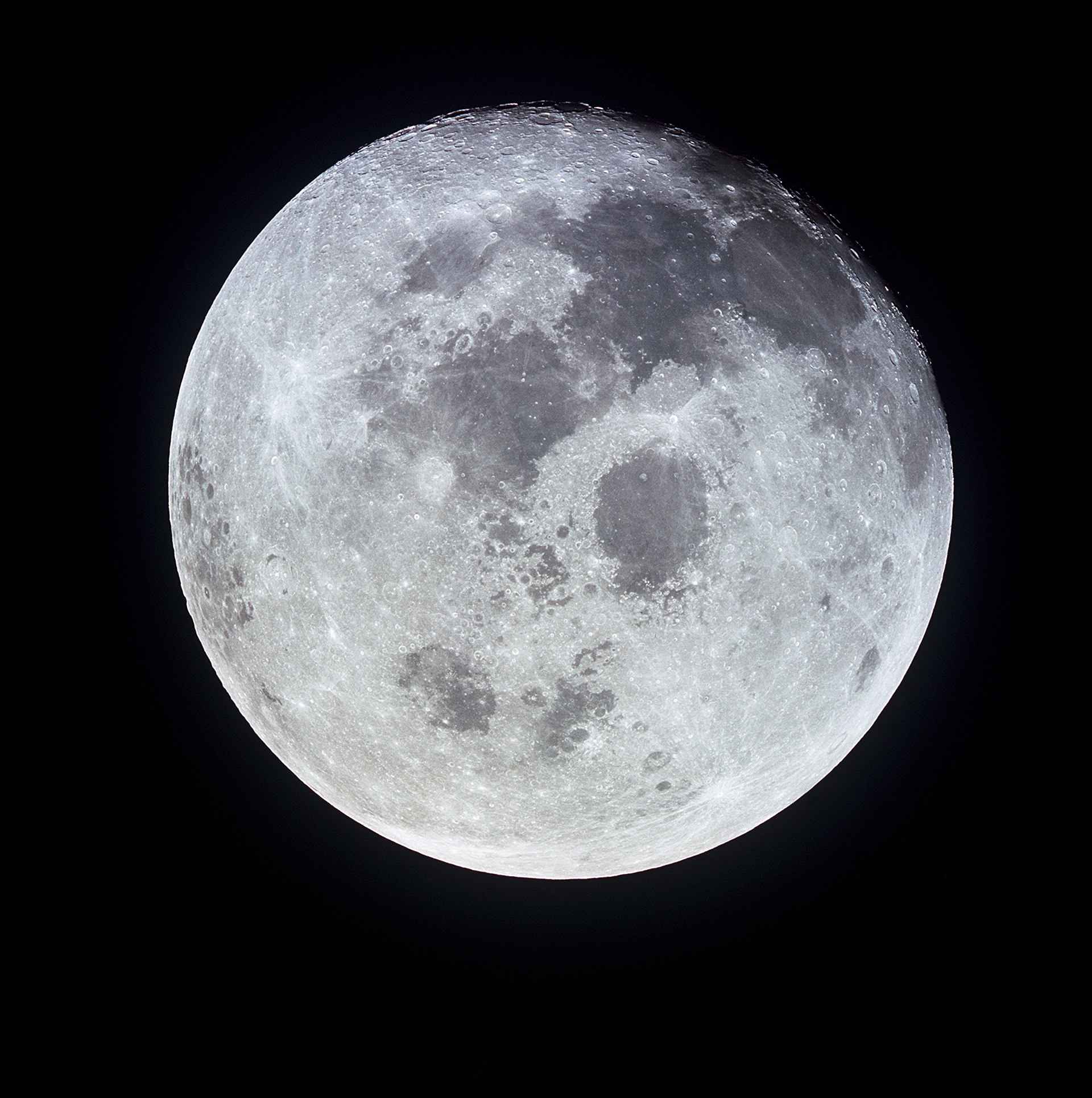 Detailed photograph of the Moon's cratered surface lit from the side